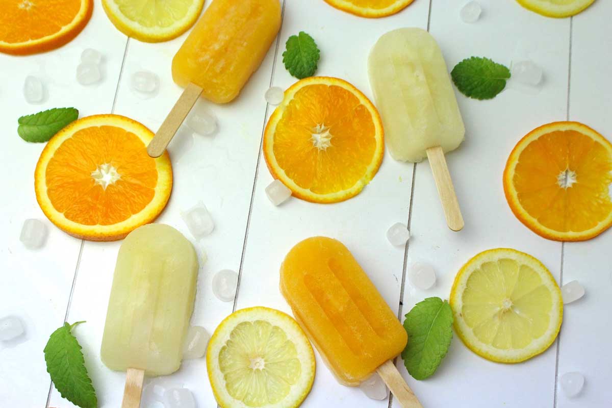 Polos de hielo de limón y de naranja